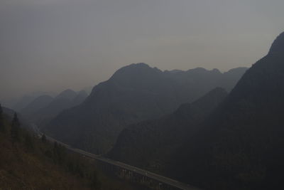 Scenic view of silhouette mountains against sky