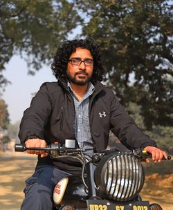 Portrait of young man riding