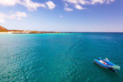 Scenic view of raft being tugged by unseen object