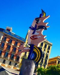 Low angle view of monument against clear blue sky