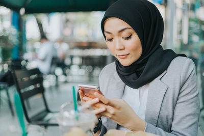 Young woman using mobile phone