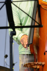 Close-up of man playing guitar