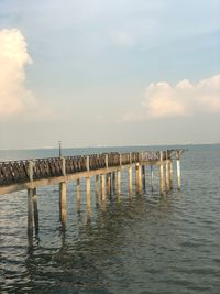 Pier on sea against sky