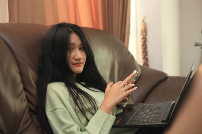 Young woman using mobile phone