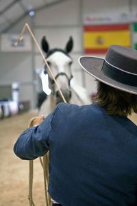 Rear view of man wearing hat