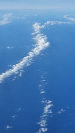 Low angle view of blue sky on sunny day