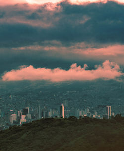 Scenic view of buildings against sky during sunset
