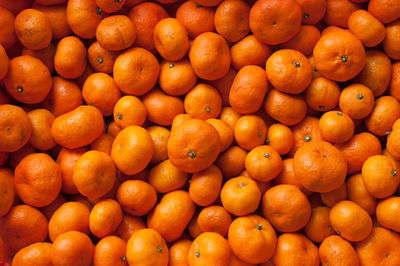 Full frame shot of oranges at market stall