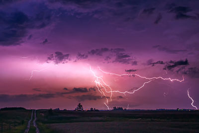 Scenic view of lightning over field