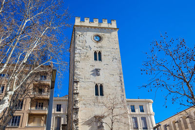 Low angle view of clock tower against sky