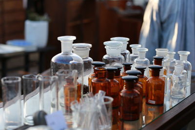 Close-up of glass bottles on table