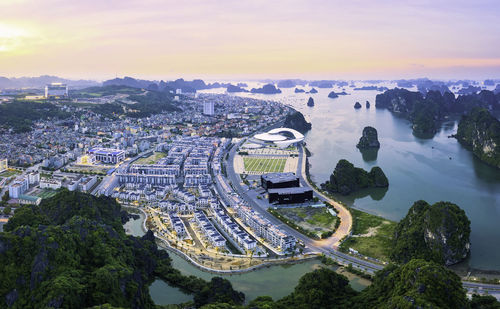 High angle view of road by buildings against sky