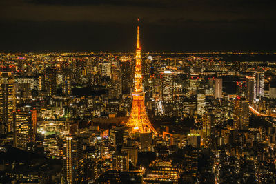 High angle view of city lit up at night