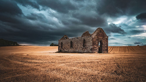 House on field against sky