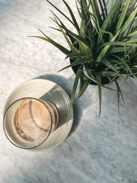 High angle view of glass bottle on table