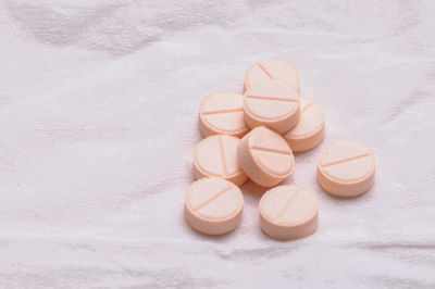 Pink tablet of medicine, studio shot
