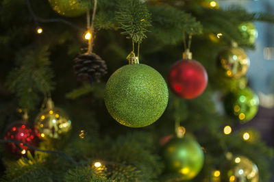 Christmas decorations hanging on tree