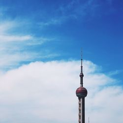 Low angle view of communications tower against sky