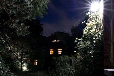 Illuminated building against sky at night