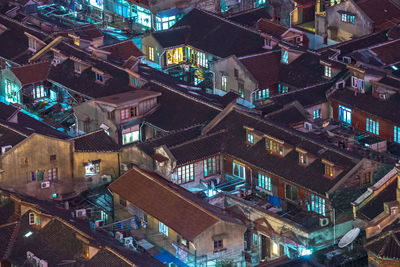 High angle view of illuminated buildings in town