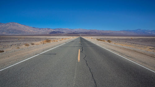 View of road at desert against sky