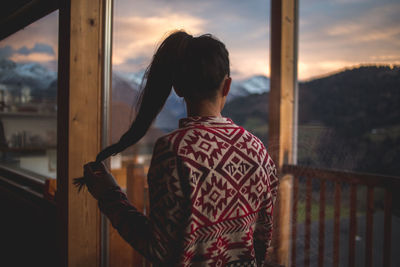 Close-up of woman standing against sky