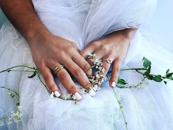 Midsection of woman holding hands