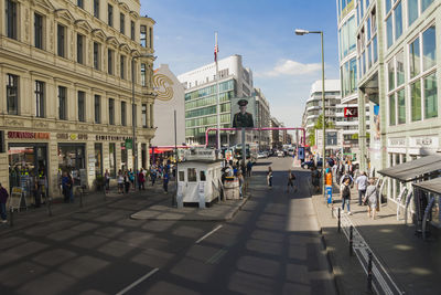 People on city street amidst buildings