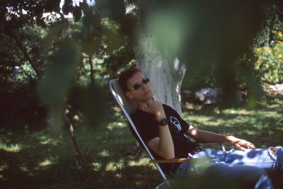 Portrait of woman sitting outdoors