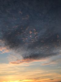 Low angle view of dramatic sky during sunset