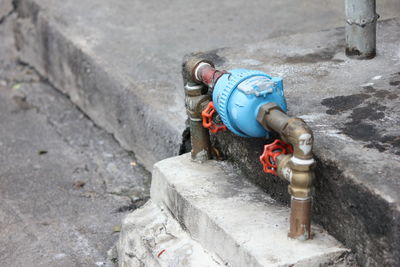 High angle view of fire hydrant against wall