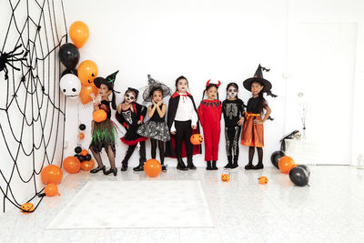 Group of people against orange background