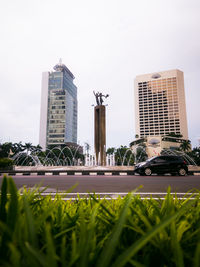 Buildings in city against sky