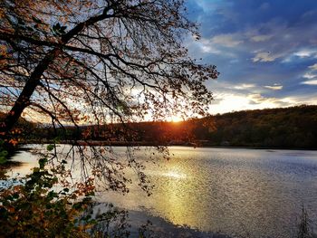 Scenic view of lake against sky during sunset