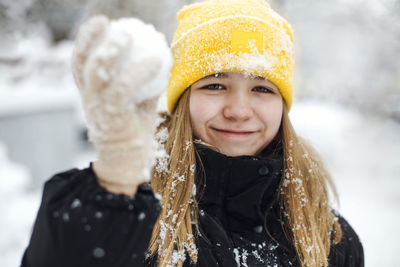 Portrait of young woman wearing warm clothes