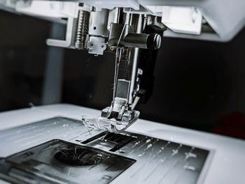 Close-up of sewing machine on action