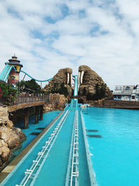 Bridge over river with city in background