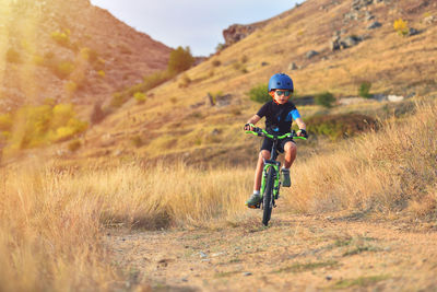 Full length of a man riding bicycle