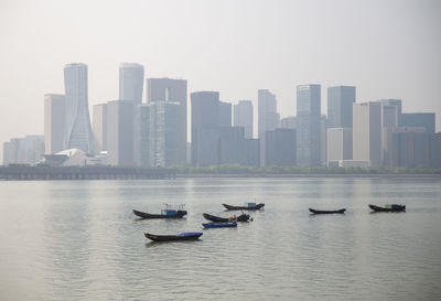 View of buildings in city against sky