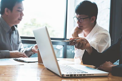 Business colleagues working at desk in office