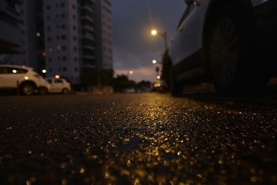 Surface level of street against buildings at night