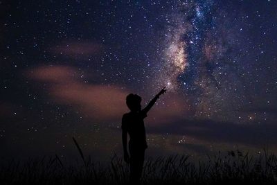 Silhouette of people at night