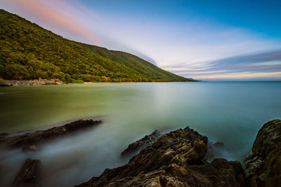 Scenic view of sea against sky at sunset