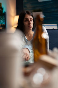 Mid adult woman sitting at table