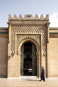 Entrance of historic building against sky