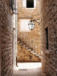 Empty alley amidst buildings