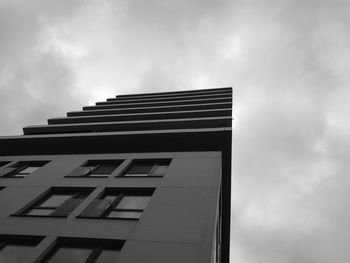 Low angle view of office building against sky