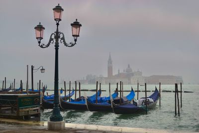 Boats moored in canal