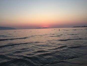 Scenic view of sea against clear sky during sunset