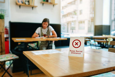 Man sitting on table in restaurant